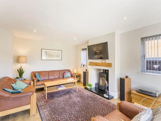 Complete with french doors which lead out onto the garden. A characterful log burner creates a warm and cosy atmosphere. Including ceiling inset spotlights and laminate flooring. The beautiful double doors open up into the kitchen diner.