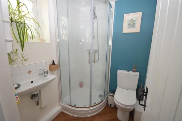This shower room is a useful addition to the ground floor. It comprises a modern suite with shower cubicle, wash hand basin with mixer tap, and low-flush WC. There is also a chrome heated towel-rail, and the room is tastefully decorated, with tiled splashbacks and contemporary Karndean flooring.