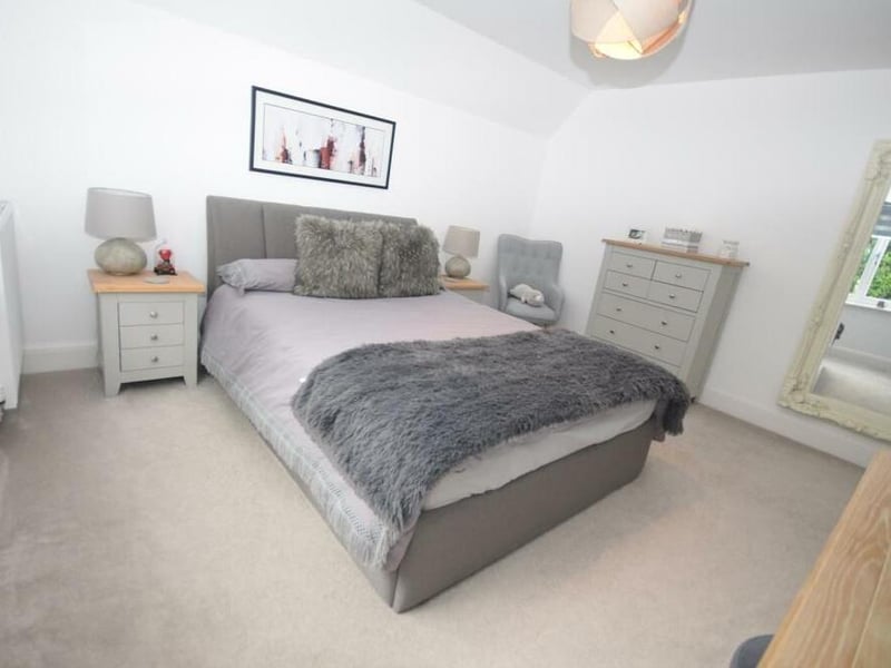 Like all the bedrooms, number three mixes comfort with light. It overlooks the back of the property.