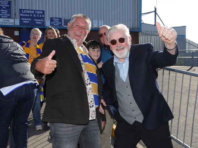 Fans await the buses to Wembley.