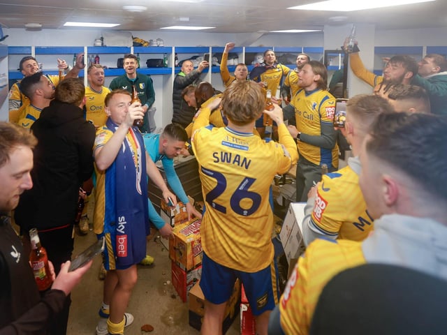 Mansfield Town's fans and players celebrated promotion to League One long into the night.