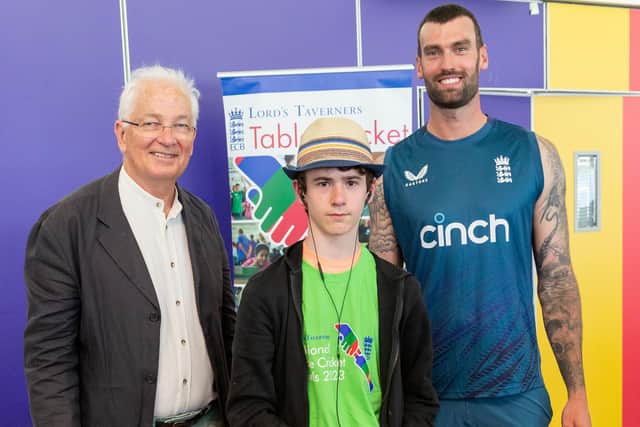 Beech Academy student Byron Stanford with David Gower and Reece Topley.