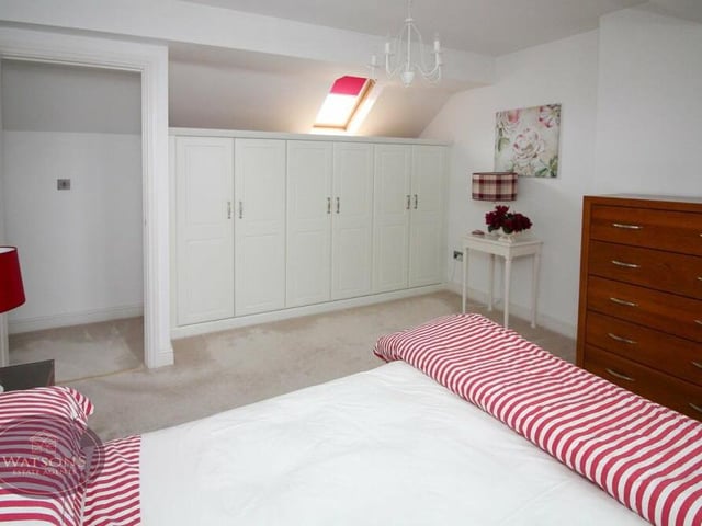 Another look at the second bedroom on the first floor. Extensive, fitted wardrobes and a Velux window with integrated blinds add to its appeal.