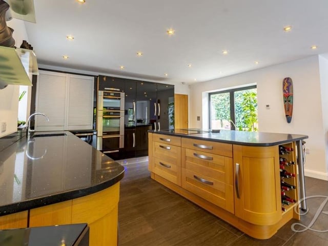 The heart of the Clipstone Road West home, says BuckleyBrown, is this contemporary kitchen, with its shaker-style cabinets and units, granite composite work surface and central island with breakfast bar. A range of full-height, integrated appliances includes two fridge/freezers, a steam oven and conventional oven, and a vacuum system.
