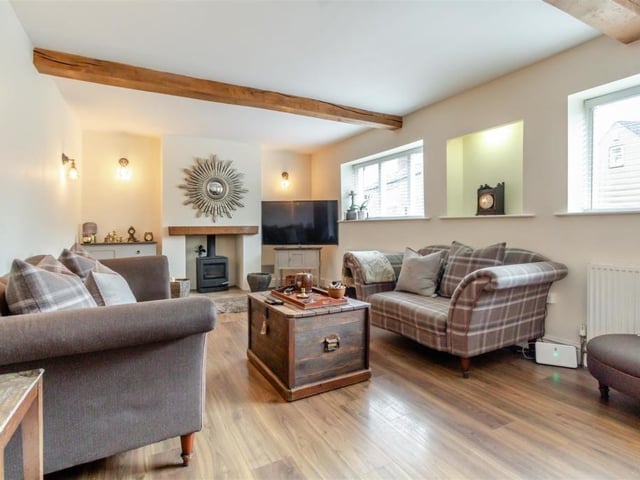 Let's begin our tour of The Old Village Post Office in the large lounge. It is blessed with lots of character thanks mainly to a log burner and two single beams across the ceiling.