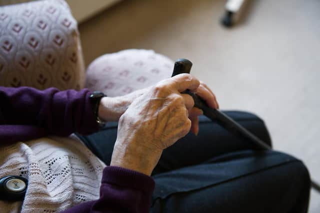 Two men tricked their way into an OAP's home.