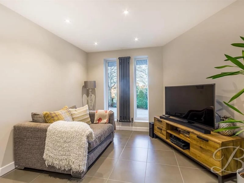 The third reception room offers a cosy snug, ideal for quiet evenings.