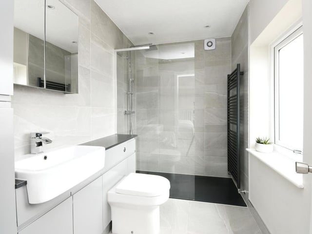 The master bedroom boasts its own en suite bathroom. A stylish number, it features a walk-in shower, wash hand basin and low-flush WC.