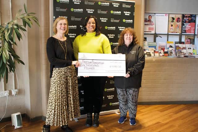 Director Felicity Mould (left) and Romo staff member (right), presenting the cheque to the Freedom Foundation CIC - Nottingham’s music and dance workshops.