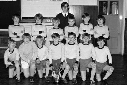 A school football team is pictured in 1971. The school closed in 2001 and became Asquith Primary School.