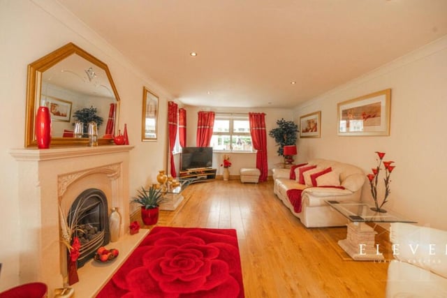 Next stop is this comfortable sitting room, with feature fireplace and underfloor heating.