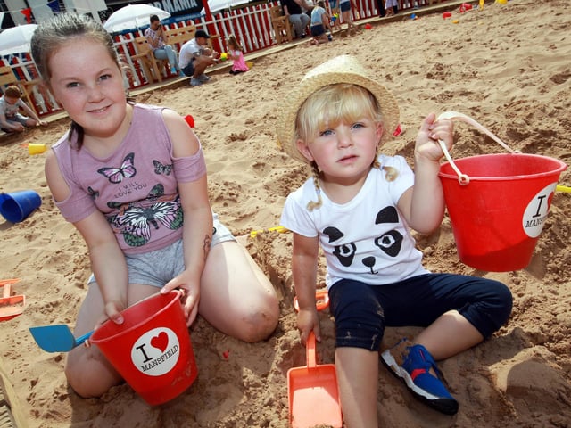 Enjoying the beach are Olivia Percival, seven, and Lexi Mae Mariott, two.