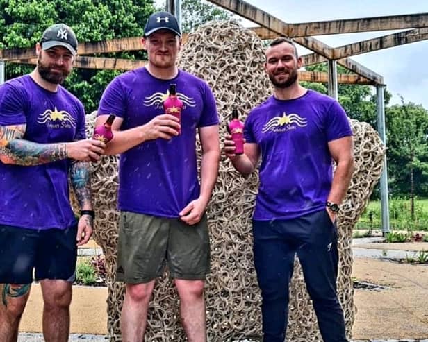 Mansfield dad Jamie Lynch (left) with hiking mates Ross Johnson and Craig Page (right) after completing a 40-mile sponsored walk last year to raise money for charity.