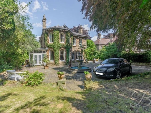 One last view of the formidable frontage of the Mansfield house which is also surrounded by lawns, shrubs and trees.