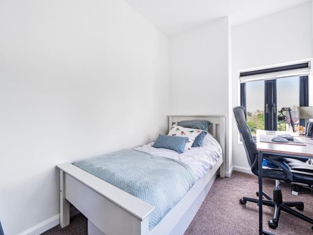 Here is the third and final bedroom, which could be a pleasant haven for a child or guest. As you can see, there is space for a desk.