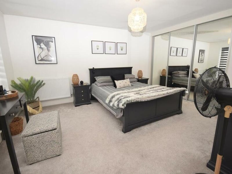 Like the master, the second double bedroom at the £600,000 property benefits from a bank of built-in wardrobes. It is a terrific size and immaculate in condition.