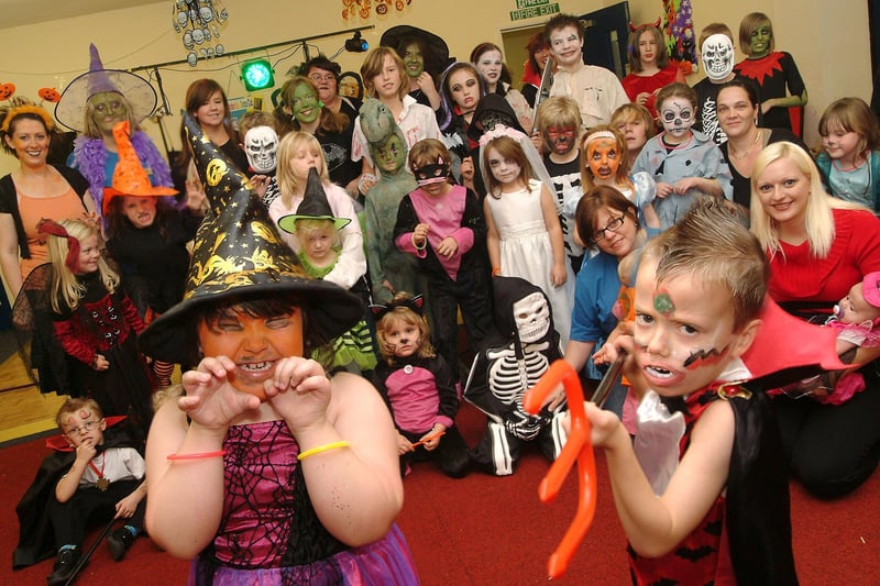Youngsters and their carers get all spooky in their Halloween costumes during a daytime Myths and Magic disco for the Elkesley Raod Play Scheme in Meden Vale, 2009.