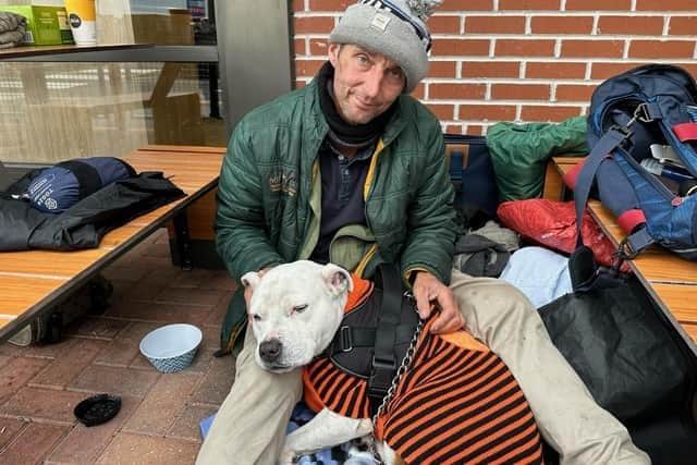 John pictured with dog, Blue, outside Nottingham Road McDonald's in Mansfield.