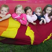 2008: Little Oaks Cool Kids Club members have fun with a hammock at a Play In The Parks event in Nuthall.