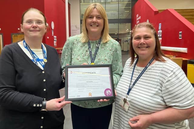 Proudly displaying the Carer-Friendly Employer Quality Mark certificate are, from left, Jane Hawksford, Sian Geeson and Teresa Harvey.