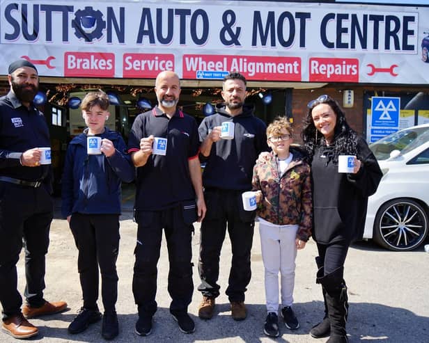 Dally Singh, Rezgar Naby, Aras Bayz and Lisa Stout, Jordan Ross and Archie Stout at the opening of Sutton Tyre and MOT centre. (Photo by: Brian Eyre/nationalworld.com)