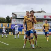 Stags congratulate Davis Keillor-Dunn on his matchwinner against Notts County.  Photo by Chris & Jeanette Holloway/The Bigger Picture.media