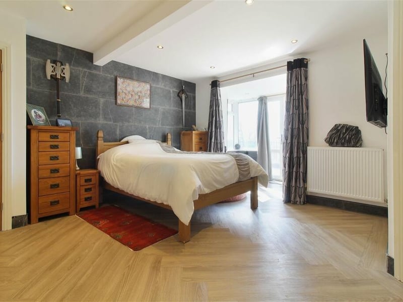 This attractive bedroom at the Sutton property is bright, comfortable and contemporary.