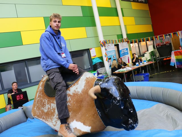 Plastering student Nathan Roe showed off his balance abilities on the rodeo bull
