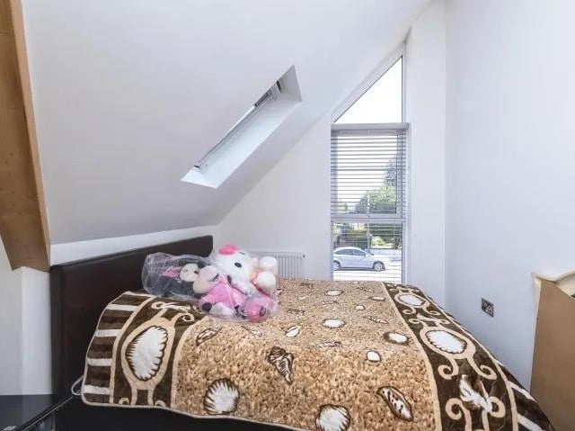 The first floor contains another good-sized double bedroom, possibly suitable for a child.