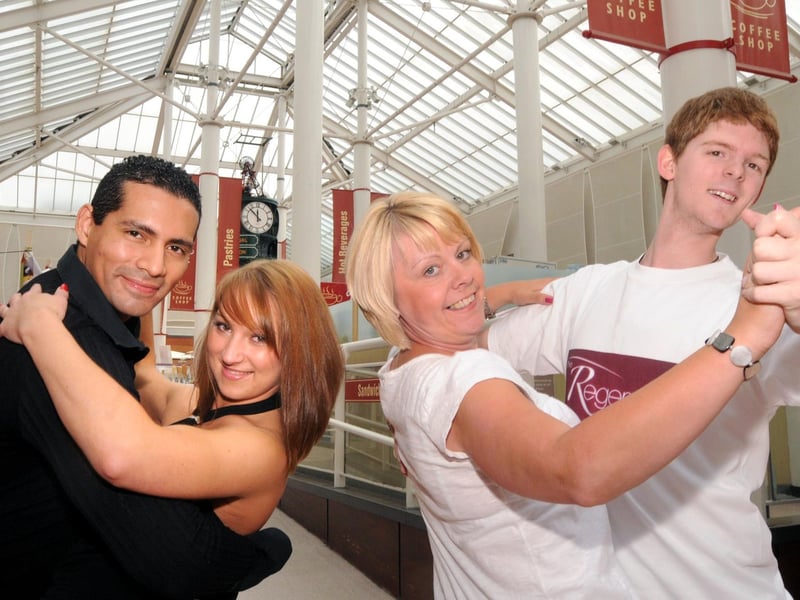 2010. Shopper Lisa Haslam 2nd left strikes a pose and does a spot of dancing in the Idlewells shopping centre at a special dance workshop held by Regency Dance centre. They are joined by dancers from South Normanton to South America Karina Shaw dance Assistant from South Normanton and Bruno Camacho Dance instructor from South America