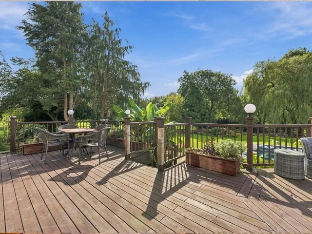 The beautiful south-facing gardens boast countryside views, multiple decking areas and a hot tub