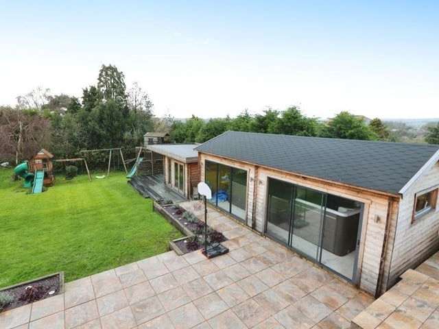 A modern wooden cabin, with bi-folding doors, within the rear garden houses a state-of-the-art Hydropool swim spa, adding luxury to your leisure time. There is also a separate hot tub.