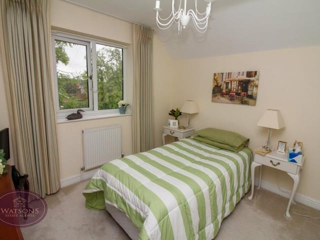 Here is the first of the bedrooms on the first floor. The window overlooks the front of the property.