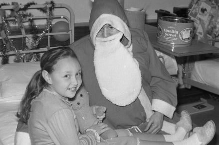 Santa visited the wards each year - do you recognise this young girl?