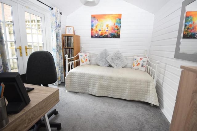 One of the three bedrooms at the Blidworth cottage is on the ground floor. It is a comfortable and flexible space, with a carpeted floor and uPVC doors leading out to the courtyard garden.