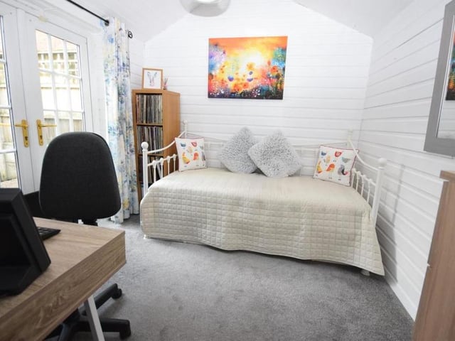 One of the three bedrooms at the Blidworth cottage is on the ground floor. It is a comfortable and flexible space, with a carpeted floor and uPVC doors leading out to the courtyard garden.