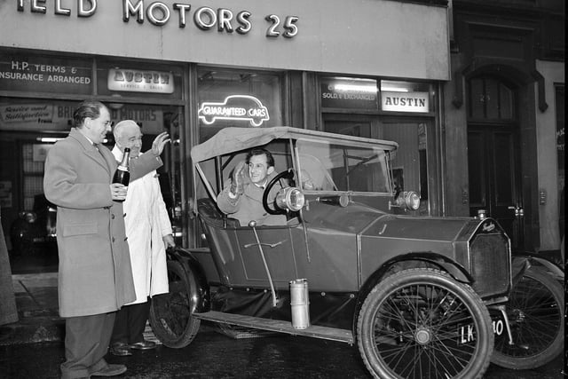 A vintage 1913 Humberette car leaves the Bruntsfield Motors garage on its journey to the Rootes Motor Museum in London in 1958.