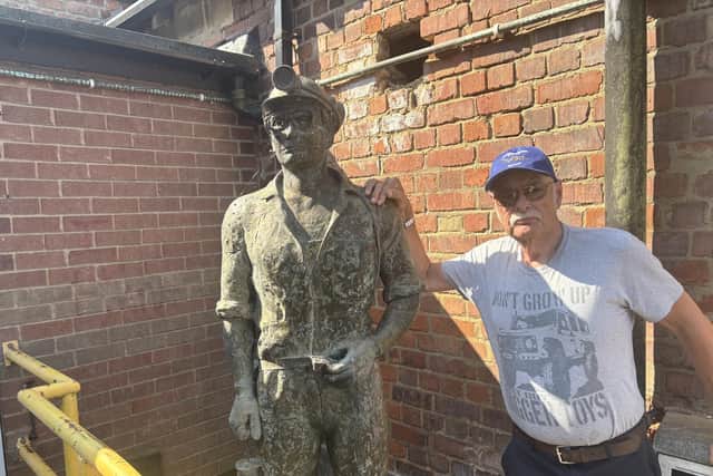 Alan Ward with the memorial to Bill McCulloch, David Shelton and Peter Alcock, outside the Bilsthorpe Heritage Museum.