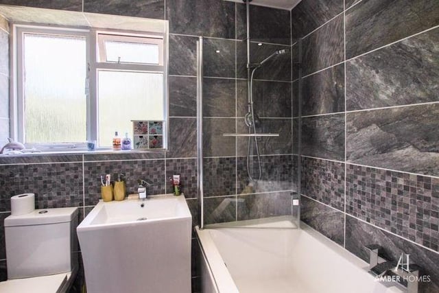 The family bathroom is beautifully appointed. A three-piece suite comprises a panelled bath, with shower over, a vanity sink and low-level WC, while the walls and floor are tiled, and a chrome heated towel-rail is always a nice bonus.