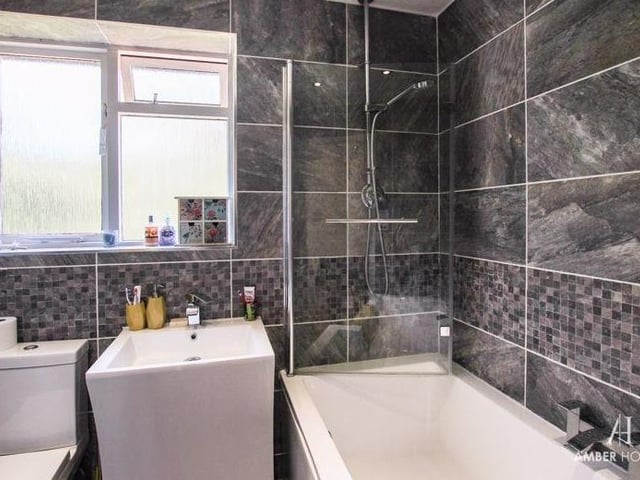 The family bathroom is beautifully appointed. A three-piece suite comprises a panelled bath, with shower over, a vanity sink and low-level WC, while the walls and floor are tiled, and a chrome heated towel-rail is always a nice bonus.