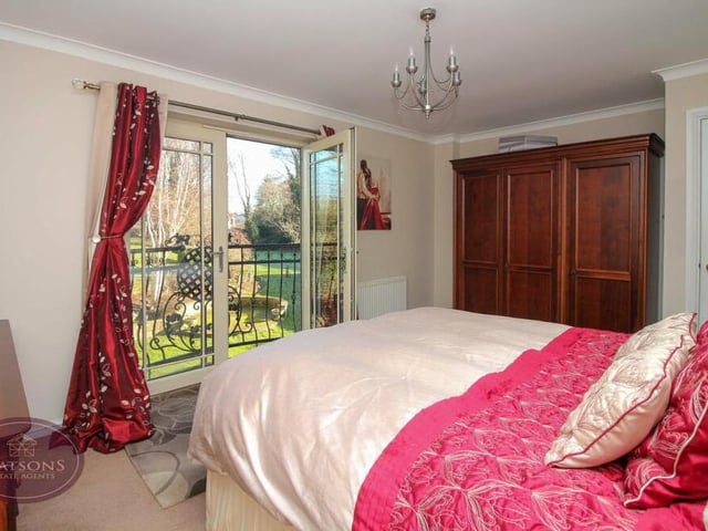 An appealing feature of the second bedroom is a Juliet balcony, accessed via French doors.