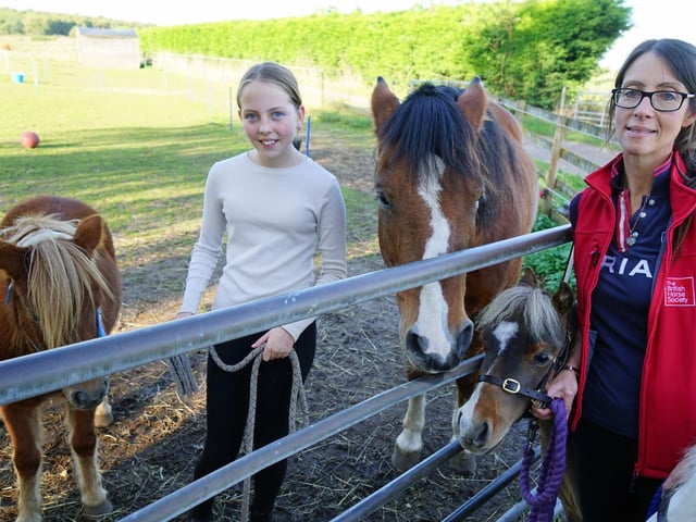 Owner Jo Shaw-Brown, Elise Shaw-Brown with Barney, Honey and Ocean.
