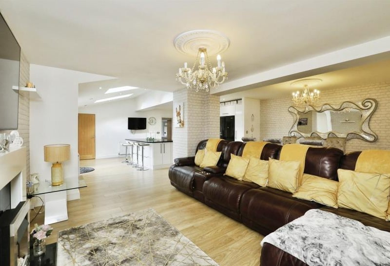 Attaching itself to the first kitchen we have just looked at is this sitting and dining area with marble fireplace.