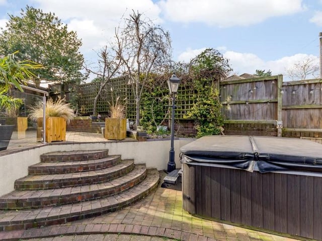 The garden at the back of the property is an attractive space, with more steps leading to a lower level.