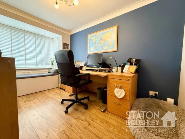 A stylish office space offers the perfect work-from-home setup or could be used as an additional bedroom if desired. F