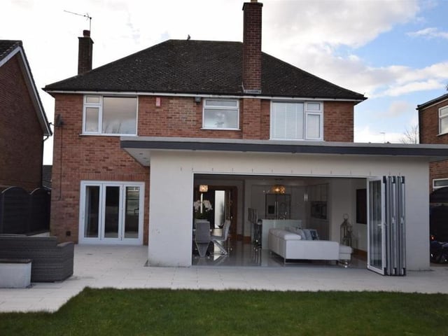 Having seen the bi-folding doors of the kitchen diner from the inside, here's the view from the mainly lawned back garden. On a warm summer's day, the doors truly bring the outside in.