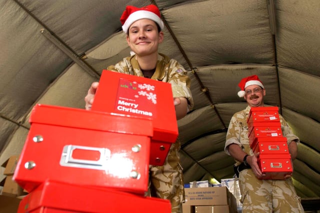 Senior Aircraft Woman Emma Yates aged 19 from Doncaster (Normally based at RAF Kinloss) made short work of sorting the Christmas boxes for troops on the  117 Accommodations unit, Basrah Iraq in 2005. Pictured with Flight Sergeant Roger Keen aged 46 from Lincoln (Normally based at RAF Waddington)