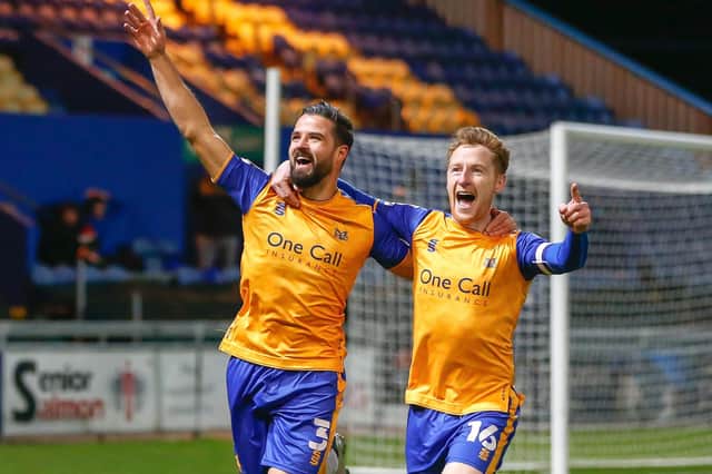 Stephen McLaughlin (left) celebrates his winner against Carlisle. Photo by  Chris Holloway/The Bigger Picture.media