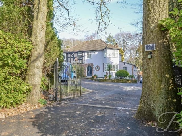 Let's step outside now, starting with the electric gate, strategically placed between two trees, that forms the entrance to the leafy Lindhurst Lane property. It lends a sense of grandeur to the house.