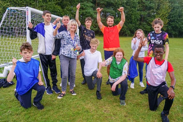 Principal Jenny McConnell, staff and pupils celebrate a rating of 'Outstanding' from Ofsted for Dawn House School in Rainworth for youngsters with special educational needs and/or disabilities.
